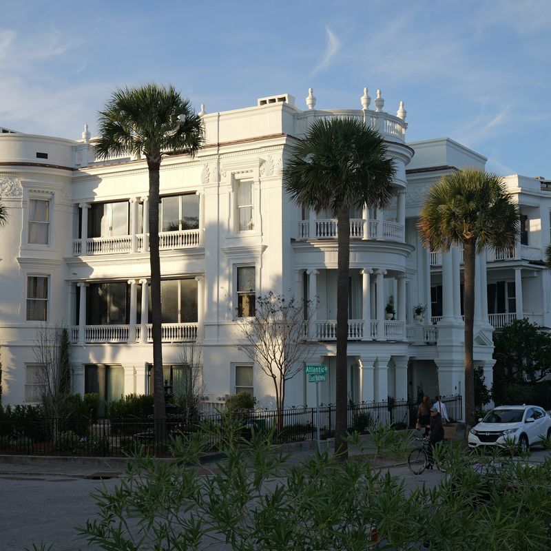 A large white house with palmettos in Charleston
